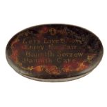 A George III tôle oval erotic snuff box, the lid painted to simulate tortoiseshell and inscribed