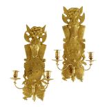 A set of four Restauration ormolu wall lights, each with a backplate decorated with a coat of arms