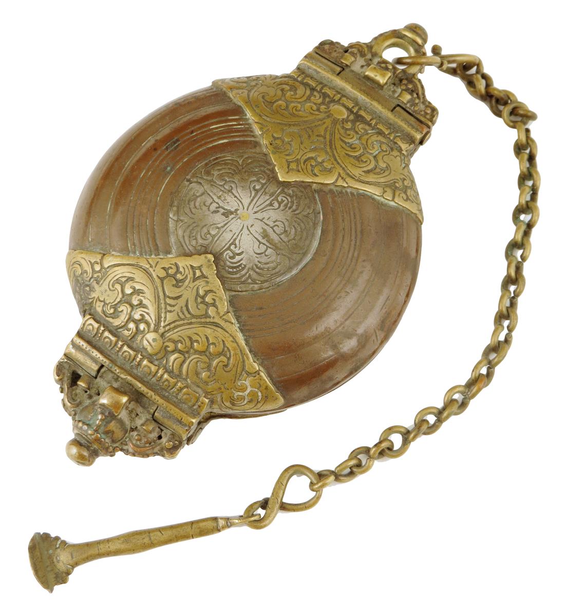 An 18th century continental brass and bronze tinder box, with leaf decoration, one end with an orb