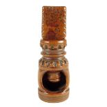 An 18th century pocket fruitwood screw action nutcracker, of barrel shape, 7.3cm long. See Owen