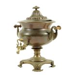 λ An early 19th century bronze and copper samovar, with a brass spout, with scroll handles with