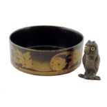 A late Victorian bronze inkwell, in the form of an owl perched on a branch with inset glass eyes,