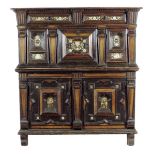 A Charles II and later oak and walnut enclosed chest, in two halves, with ebonised decoration and