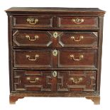 A late 17th century oak chest, with two short and three long drawers with panelled fronts, 92.7cm