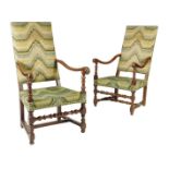 Two similar 18th century walnut open armchairs, each with an upholstered back and seat, with