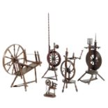 A collection of five spinning wheels, in fruitwood, ash and beech, 18th / 19th century, 149cm