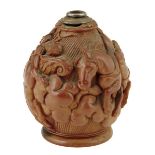 An early 19th century French carved coquilla nut snuff flask, with a white metal top with a body