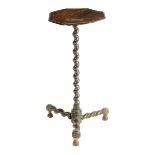 An oak candlestand, the hexagonal fixed top on a spiral twist stem and conforming tripod legs,