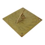 A brass sundial, with an 'S' shaped gnomon and engraved with a sun head and the date '1752', 20.1