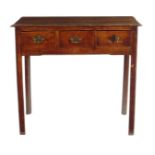 A George III fruitwood and elm side table, fitted with three frieze drawers on moulded and chamfered