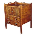 A large George III mahogany tray-top bedside commode, the gallery pierced with three handgrips above