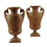A pair of 19th century pottery neo-classical vases by Wilhelm Schiller & Son, each with fluted