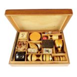 A Victorian magic set, the mahogany box with a lift-off cover revealing a divided interior with