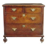 A George II oak chest, the boarded top with an applied moulded edge above two short and two long