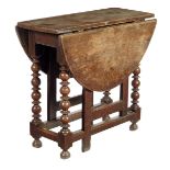 A small William and Mary oak gateleg table, the oval drop-leaf top on bobbin and disc turned legs