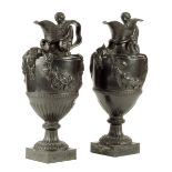 A pair of 19th century Wedgwood black basalt wine and water ewers, modelled with Bacchus and