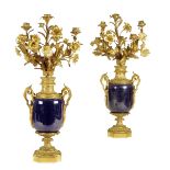 A pair of Napoleon III ormolu and porcelain candelabra in Louis XVI style, each with a royal blue