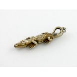 A novelty silver-gilt crocodile retractable pencil, possibly Egyptian circa 1920, modelled in a