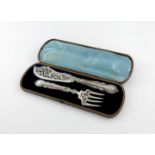 A pair of Victorian silver fish servers, by George Unite, Birmingham 1885, pierced foliate scroll