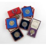 A 1939 Jubilee Medal, boxed; together with a small collection of cased commemorative medallions