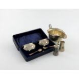 A mixed lot of silver items, various dates and makers, comprising: two novelty pepper pots, modelled