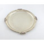 A silver tray, by Walker and Hall, Sheffield 1952, shaped circular form, shell and reed border,
