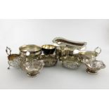 A mixed lot of silver items, various dates and makers, comprising: a George III cruet stand base,