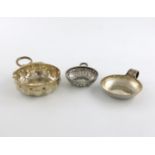 A collection of three French silver wine tasters, comprising: a 19th century one, Paris circa 1800-