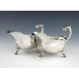 A pair of George II silver sauce boats, by Jacob Marsh, London 1748, oval form, wavy-edge border,