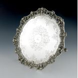 A Victorian silver salver, by Martin, Hall and Co, Sheffield 1854, circular form, with an applied