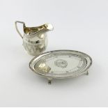 A George III silver teapot stand, by Peter and Ann Bateman, London 1794, oval form, engraved foliate