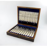 A set of twelve silver fruit knives and forks, by W and R Sorley, London 1916, plain blades,