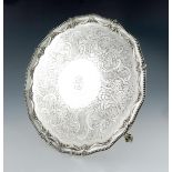 A George III silver salver, by Crouch and Hannam, London 1774, circular form, foliate draped and
