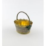 A continental parcel-gilt silver and enamel swing-handled basket, unmarked, oval form, rope-work