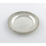 A George III silver counter dish, by Thomas Robins, London 1817, circular form, gadroon border,