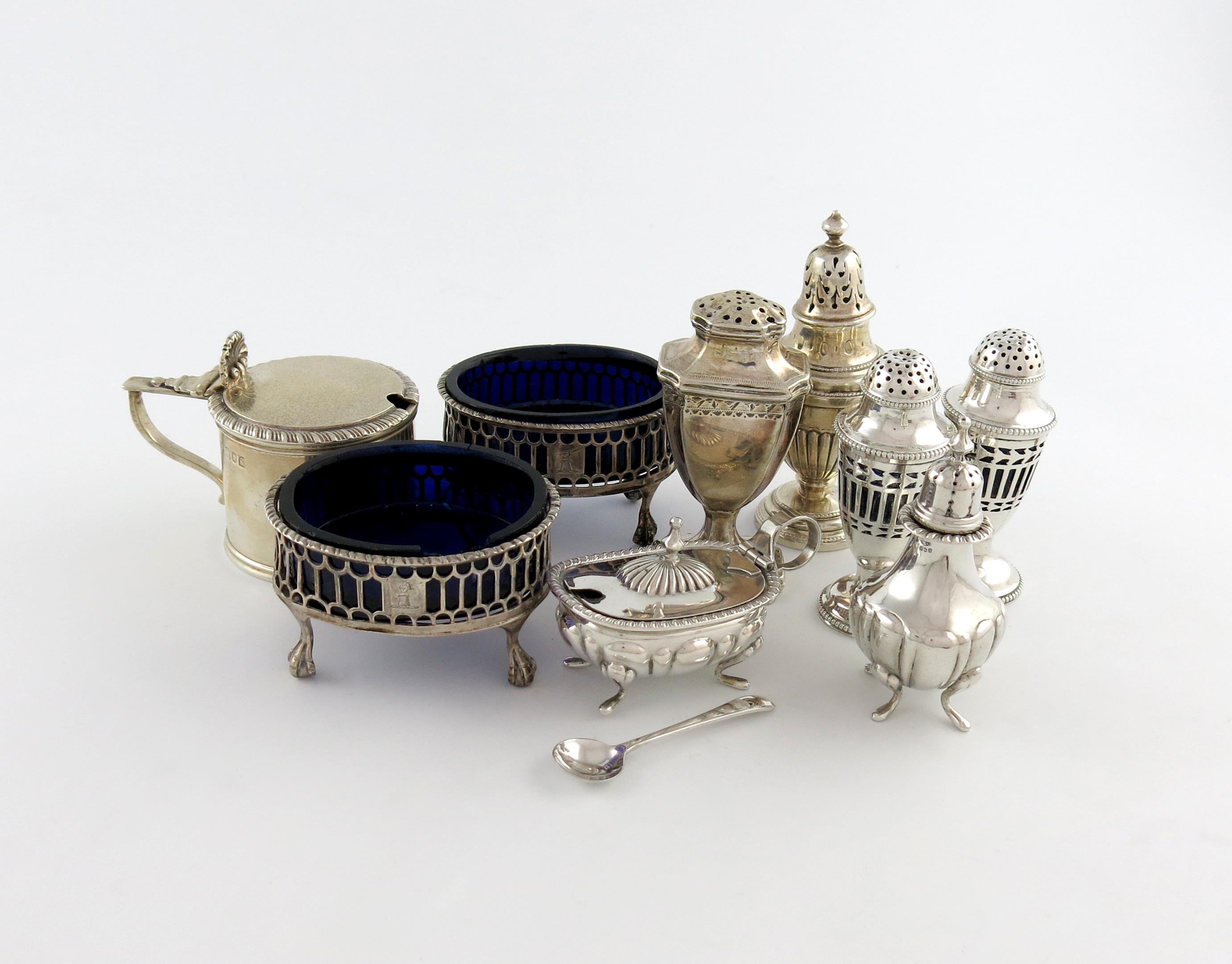 A mixed lot of silver condiments, various makers and dates, comprising: a pair of George III salt