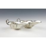 A pair of small Edwardian silver sauce boats, by Williams Limited, Birmingham 1902, elongated oval