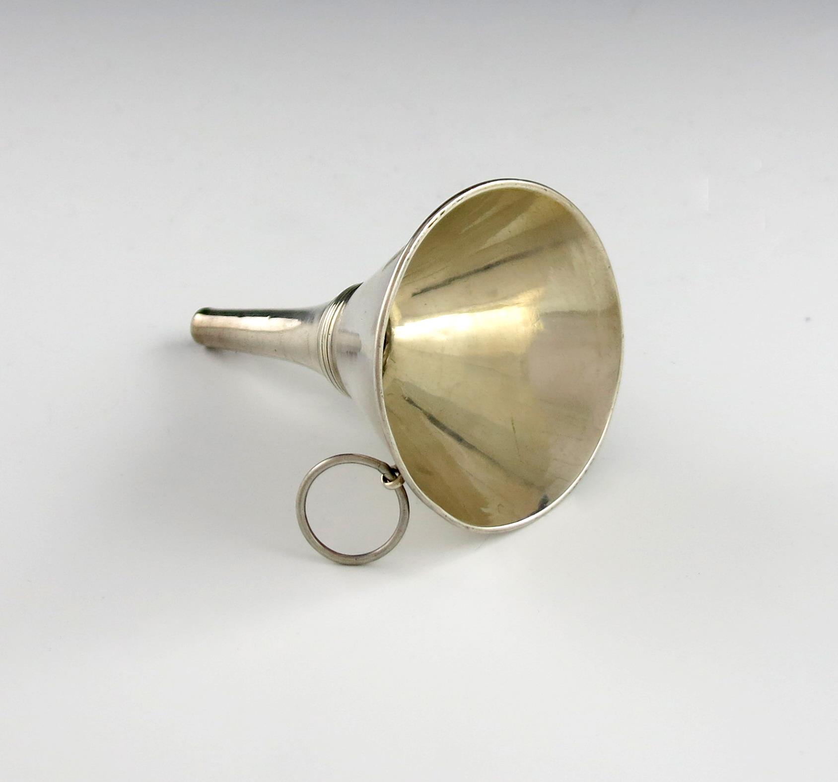 An 18th century silver spirit funnel, unmarked, conical form, with a ring attachment, height 9cm,