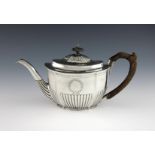 A George III silver teapot, by Urquhart and Hart, London 1801, oval form, part-fluted decoration,