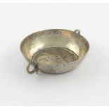 A 19th century continental silver wine taster, unmarked, possibly Scandinavian, circular form, the