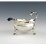 A George III silver cream boat, by William and John Deane, London 1763, oval form, wavy-edge border,