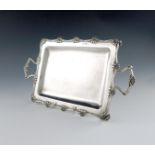 An Edwardian two-handled silver tray, by William Hutton and Sons, Sheffield 1909, rectangular