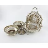 A Victorian electroplated biscuit box, of shell form, the two hinged compartments open to reveal two