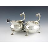 A pair of Victorian silver sauce boats, by George Richards, London 1848, oval bellied form, shell