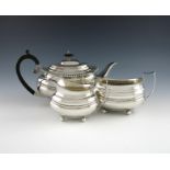 A three-piece silver tea set, by Richard Burridge, retailed by Harrods, Sheffield 1936, oblong