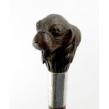 A silver-mounted novelty carved wooden walking stick, maker's mark worn, London 1929, the handle