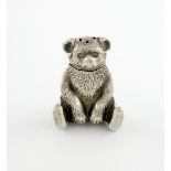 An Edwardian novelty silver teddy bear pepper pot, by J. Gloster Limited, Birmingham 1909,