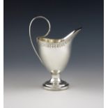 An early-19th century German silver cream jug, maker's mark of W, Arolsen, circa 1800-1810, helmet