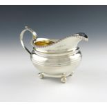 A George IV provincial silver cream jug, by John Walton, Newcastle 1822, oval form, fluted girdle