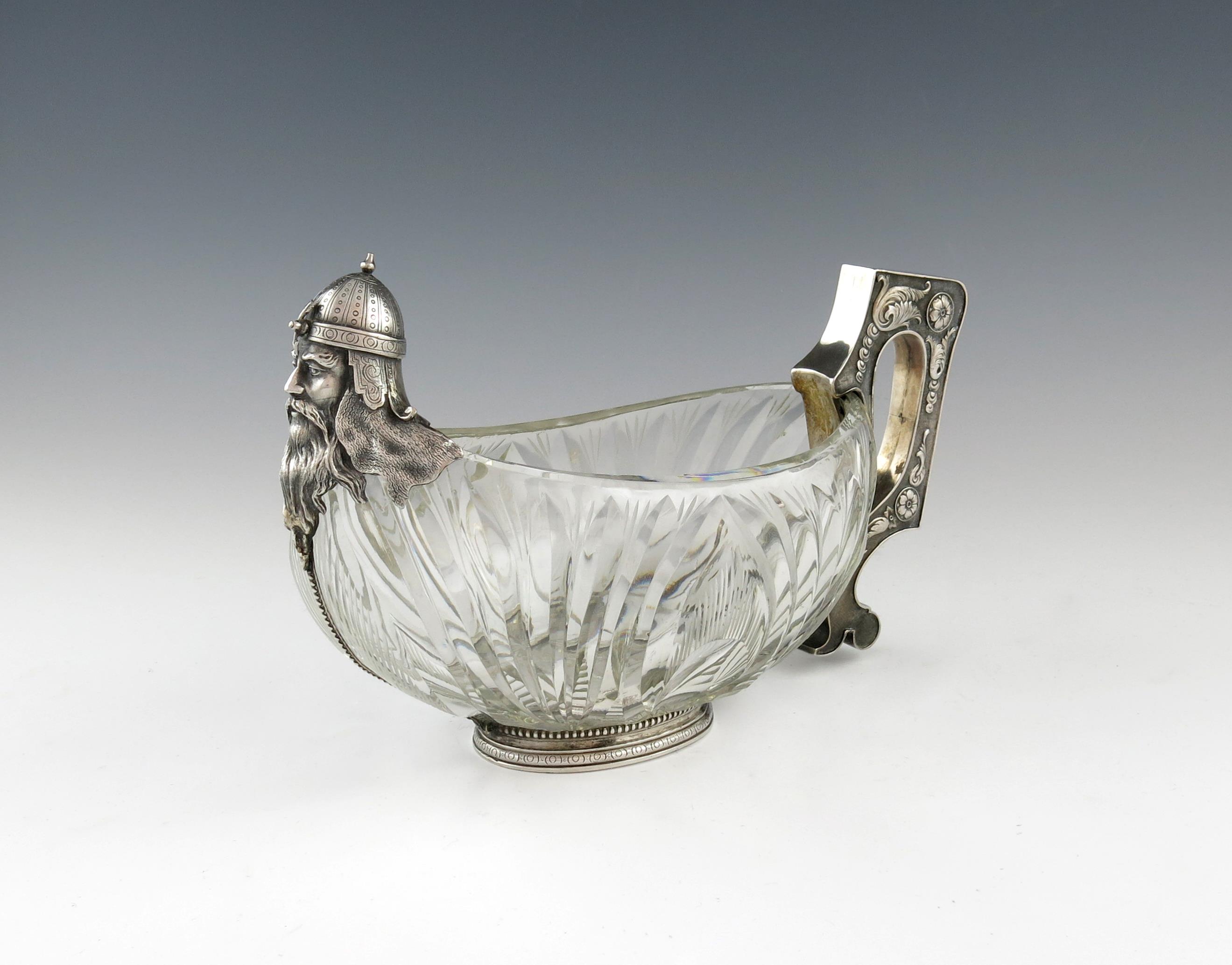 A metalware-mounted glass warrior kovsch, bearing pseudo Russian marks, oblong form, cut decoration,